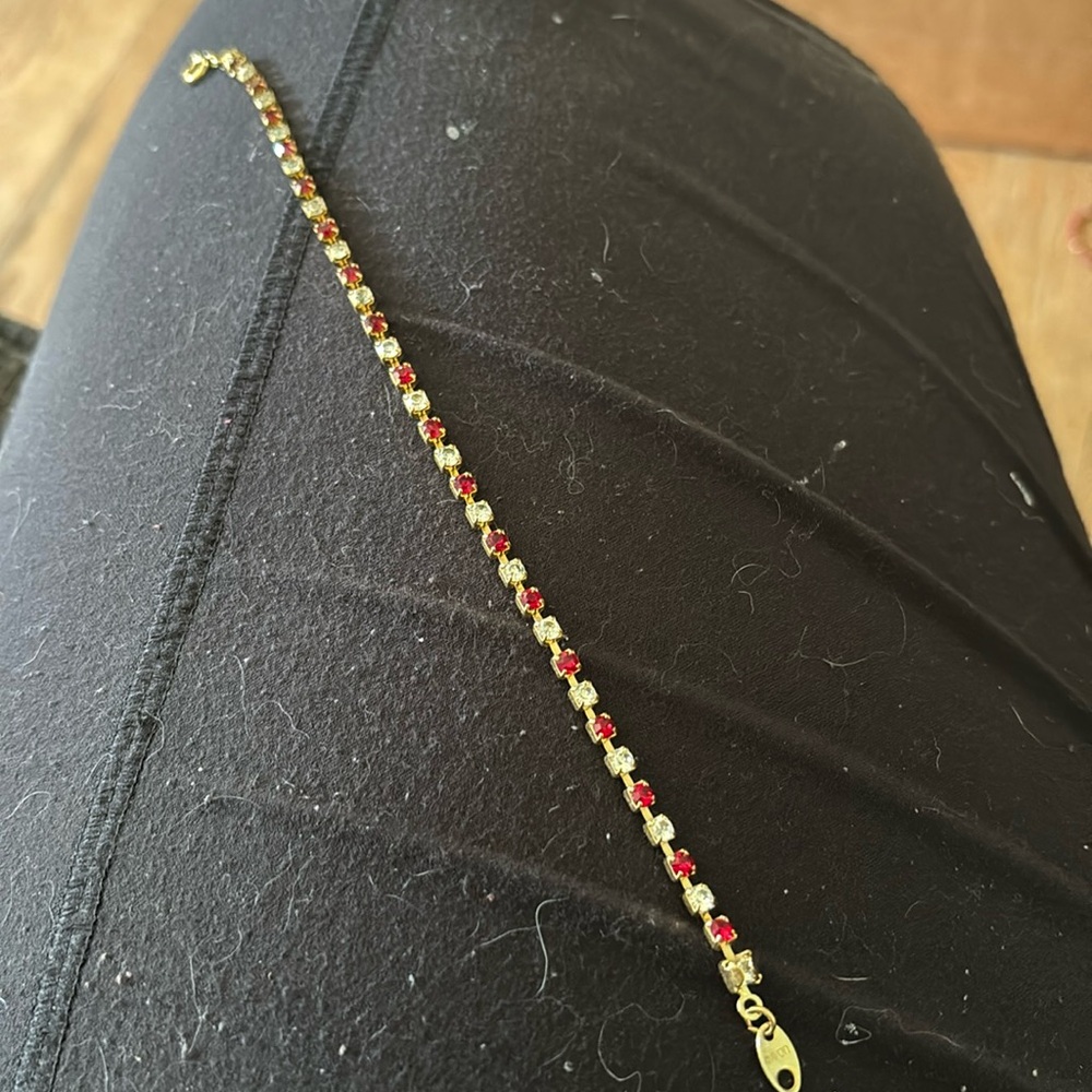 Avon Gold Tone Tennis Bracelet July Birthstone Ruby Color & Clear Crystal 7 inch
